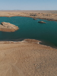 Arid Yadan Landscape and A Moist Lake in Gobi Desert in Hami.