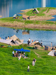 Tourists Play on The Yangtze River Beach in Chongqing.