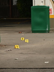 Evidence Markers At Scene Of 35-Year-Old Male Inside Pickup Truck In Gas Station Parking Lot Shot And Killed