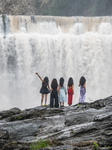  Tourists Enjoy Cooling Off at the Diaolan Waterfall in Bijie.