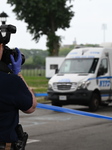 Crime Scene Investigators At Shooting Scene Near New York City Migrant Shelter