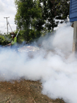 A Worker Fumigates To Prevent The Spread Of Dengue Fever 