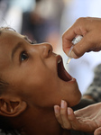 Palestinian Child Receives Polio Vaccination at UK-MED Field Hospital in Khan Younis Amid Conflict