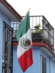 Mexican Flag Hanging In A Window