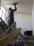 Repairs are underway at residential buildings damaged by shelling in Kharkiv.