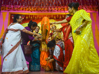 Devotees Performing Nabapatrika Ritual On The Occasion Of The Durga Puja Festival In Kolkata, India