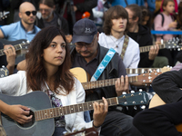 Guitar Players Are Simultaneously Played A Song In Sofia.