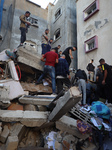 Palestinians Inspect Buildings Bombed