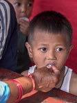 Health Worker Administers Vitamin A Capsule To Child In Nepal.