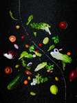 Go Green. Deconstructed Garden Salad Ingredients Floating On Black Background