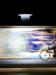 Urban Cyclist On A Foggia Bike Lane At Night