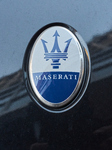 The Maserati Logo On The Hood Of A Car