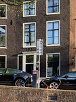 Electric Cars Charging Along Amsterdam Canal