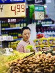 Consumers shop at a supermarket in Qingzhou.