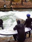 Surfers Brave The Icy Waters Of The Eisbach Stream In Munich In Autumn