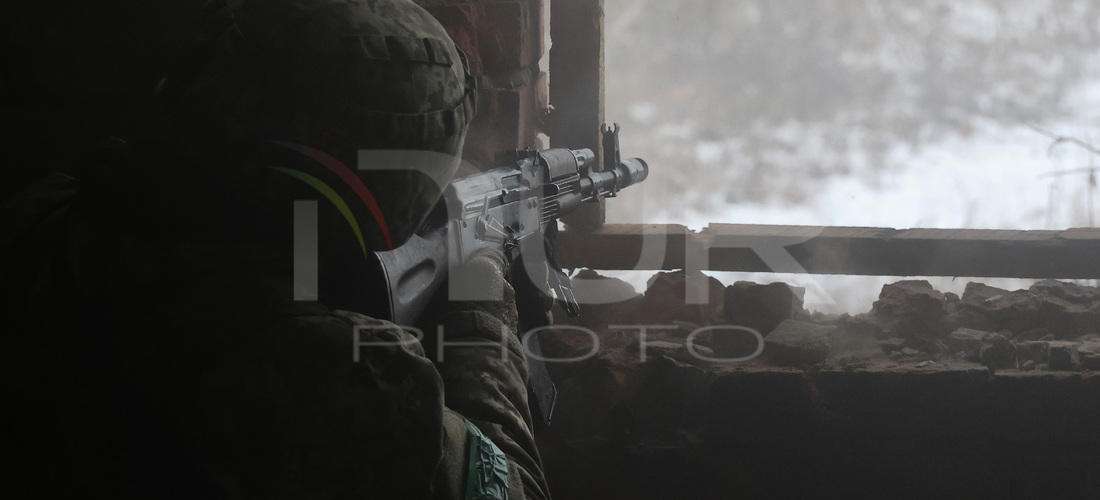 One of the new soldiers of the 57th Otaman Kost Hordiienko Motorized Brigade practices assault skills in the Kharkiv region, Ukraine, on Nov...