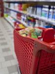 Shopping Cart In A Supermarket Aisle