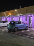 Electric Vehicle Charging Station At Night 