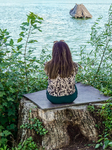 Woman Reflecting. A Moment Of Solitude By The Lake