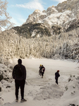 People Hiking Around The Bavarian Alpine Lake Eibsee In Winter