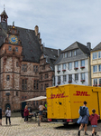 DHL Delivery Van At The Historic Marketplace Of Marburg 