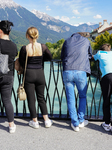 People Admiring The Inn River In Innsbruck