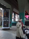 Woman With Baby Stroller Under A Munich Bridge