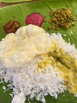 Traditional Sadya Meal Is Served On A Banana Leaf