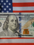 U.S. Dollars and U.S. Flag.