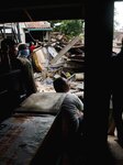 An Excavator Demolishing A House In A Slum Area In Jakarta