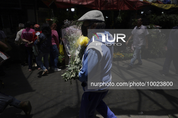 A person holds a bouquet of flowers inside the Jamaica Market in Mexico City where dozens of people came to buy flowers and gifts for Mother...