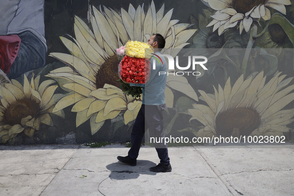 A person holds a bouquet of flowers inside the Jamaica Market in Mexico City where dozens of people came to buy flowers and gifts for Mother...