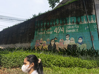 A mural promoting awareness of the coronavirus disease (Covid-19) are seen in Jakarta, Indonesia, on May 09, 2023. The World Health Organiza...