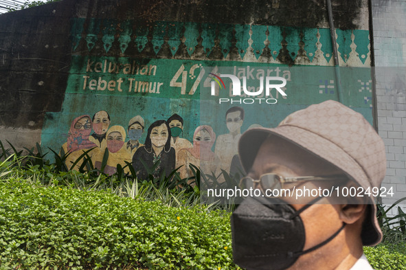 A mural promoting awareness of the coronavirus disease (Covid-19) are seen in Jakarta, Indonesia, on May 09, 2023. The World Health Organiza...