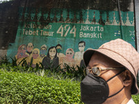 A mural promoting awareness of the coronavirus disease (Covid-19) are seen in Jakarta, Indonesia, on May 09, 2023. The World Health Organiza...