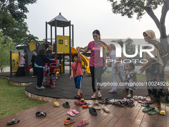 JAKARTA, INDONESIA - MAY 09 : Children playing without wearing a mask at public park in Jakarta, Indonesia, on May 09, 2023. The World Healt...