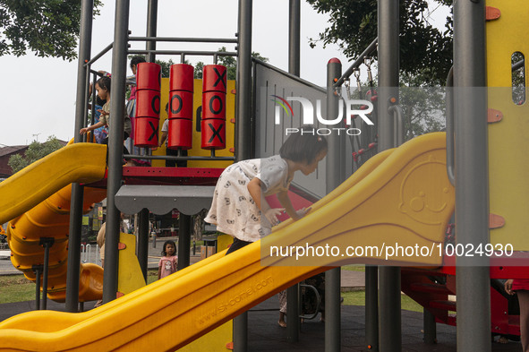 JAKARTA, INDONESIA - MAY 09 : Children playing without wearing a mask at public park in Jakarta, Indonesia, on May 09, 2023. The World Healt...