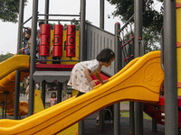 JAKARTA, INDONESIA - MAY 09 : Children playing without wearing a mask at public park in Jakarta, Indonesia, on May 09, 2023. The World Healt...