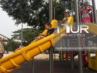 JAKARTA, INDONESIA - MAY 09 : Children playing without wearing a mask at public park in Jakarta, Indonesia, on May 09, 2023. The World Healt...