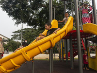 JAKARTA, INDONESIA - MAY 09 : Children playing without wearing a mask at public park in Jakarta, Indonesia, on May 09, 2023. The World Healt...