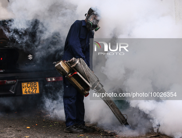 A health worker uses an anti-mosquito fumigation machine to control mosquitoes in Colombo, Sri Lanka. May 10, 2023. The dangerous dengue vir...