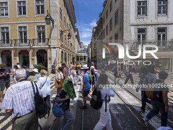 People are seen walking along one of the streets in the neighborhood of Baixa, Lisbon. 02 May 2023.  (