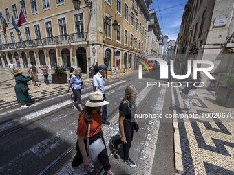 People are seen walking along one of the streets in the neighborhood of Baixa, Lisbon. 02 May 2023.  (