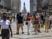 People are seen walking in Da Prata street, in the neighborhood of Baixa, Lisbon. 02 May 2023. (