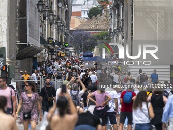 People are seen walking near the Augusta arch in Praca de Comercio, in the Baixa neighborhood, Lisbon. 02 May 2023. (