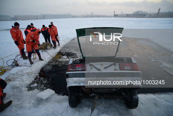 Rescuers of the Russian Service Emergency Situations Ministry perform a rescue during exercises on the frozen Neva River in St. Petersburg,...