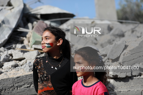 Palestinian children participate in an activity aimed to support the mental health of children affected by the recent Israel-Gaza fighting,...