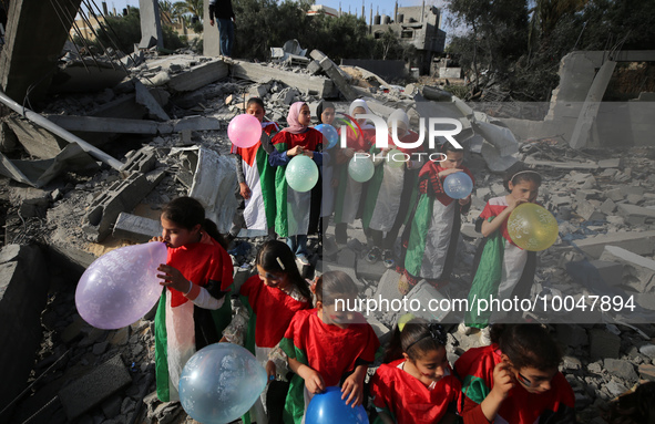 Palestinian children participate in an activity aimed to support the mental health of children affected by the recent Israel-Gaza fighting,...