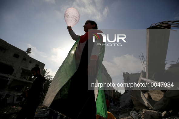 Palestinian children participate in an activity aimed to support the mental health of children affected by the recent Israel-Gaza fighting,...