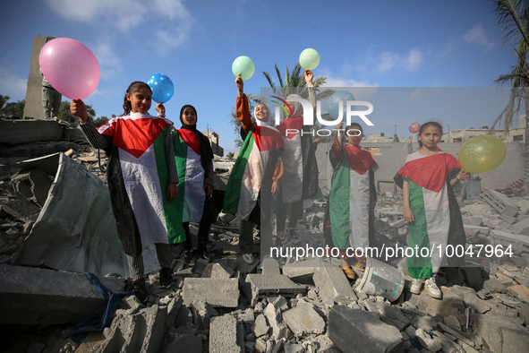 Palestinian children participate in an activity aimed to support the mental health of children affected by the recent Israel-Gaza fighting,...